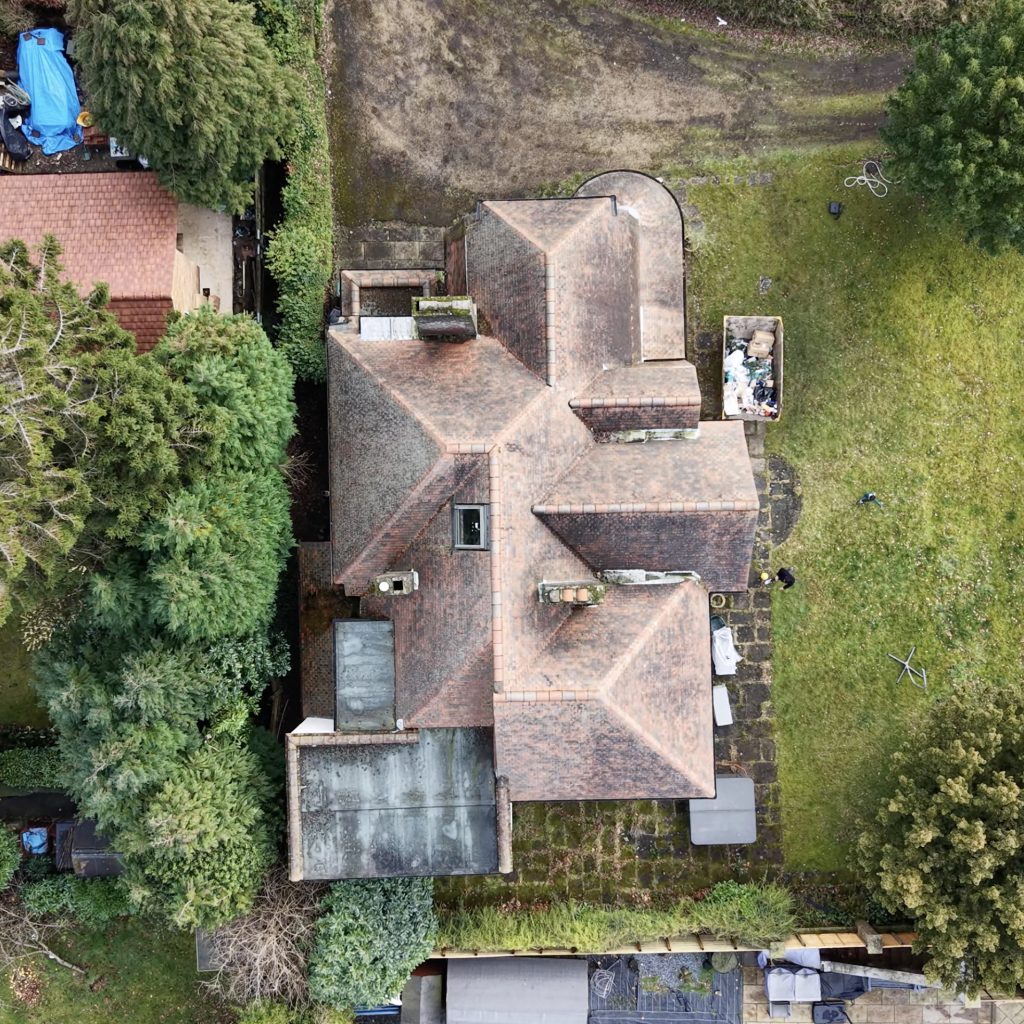 Aerial drone roof inspection of a residential property in London showing full roof layout and condition